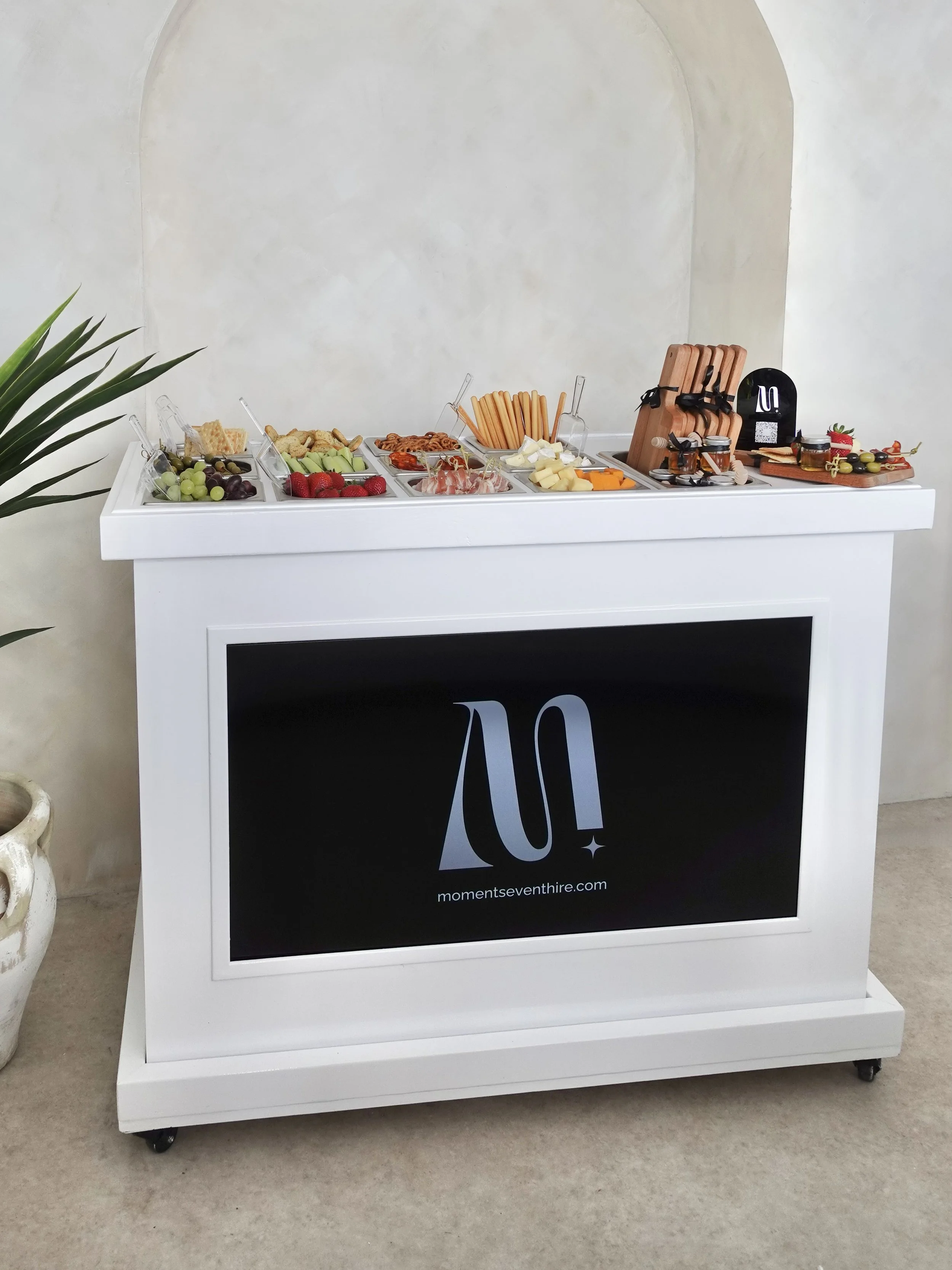 Charcuterie cart ready to delight guests with a gourmet selection of meats, cheeses, and delicacies.