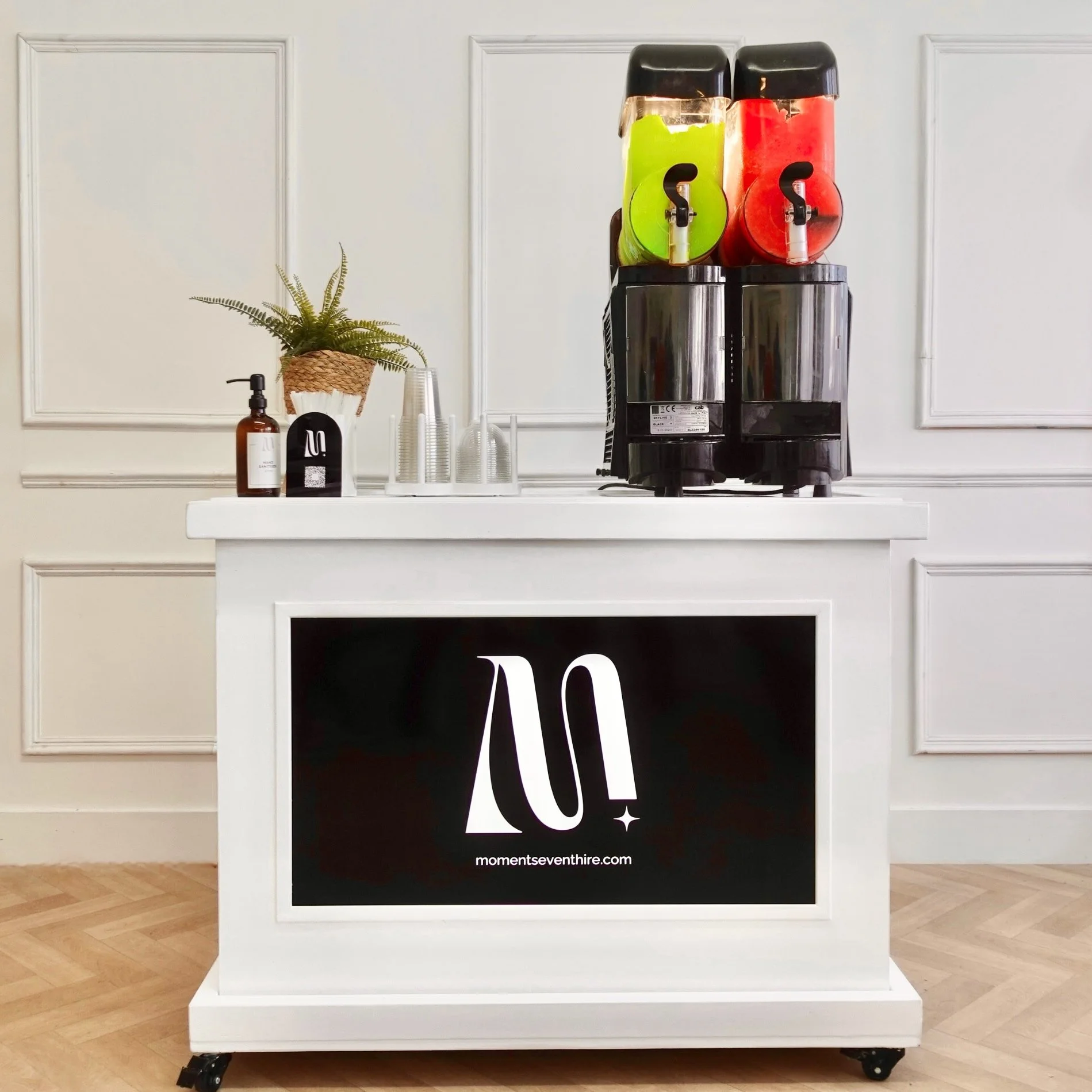 Slush machine on white cart with digital screen