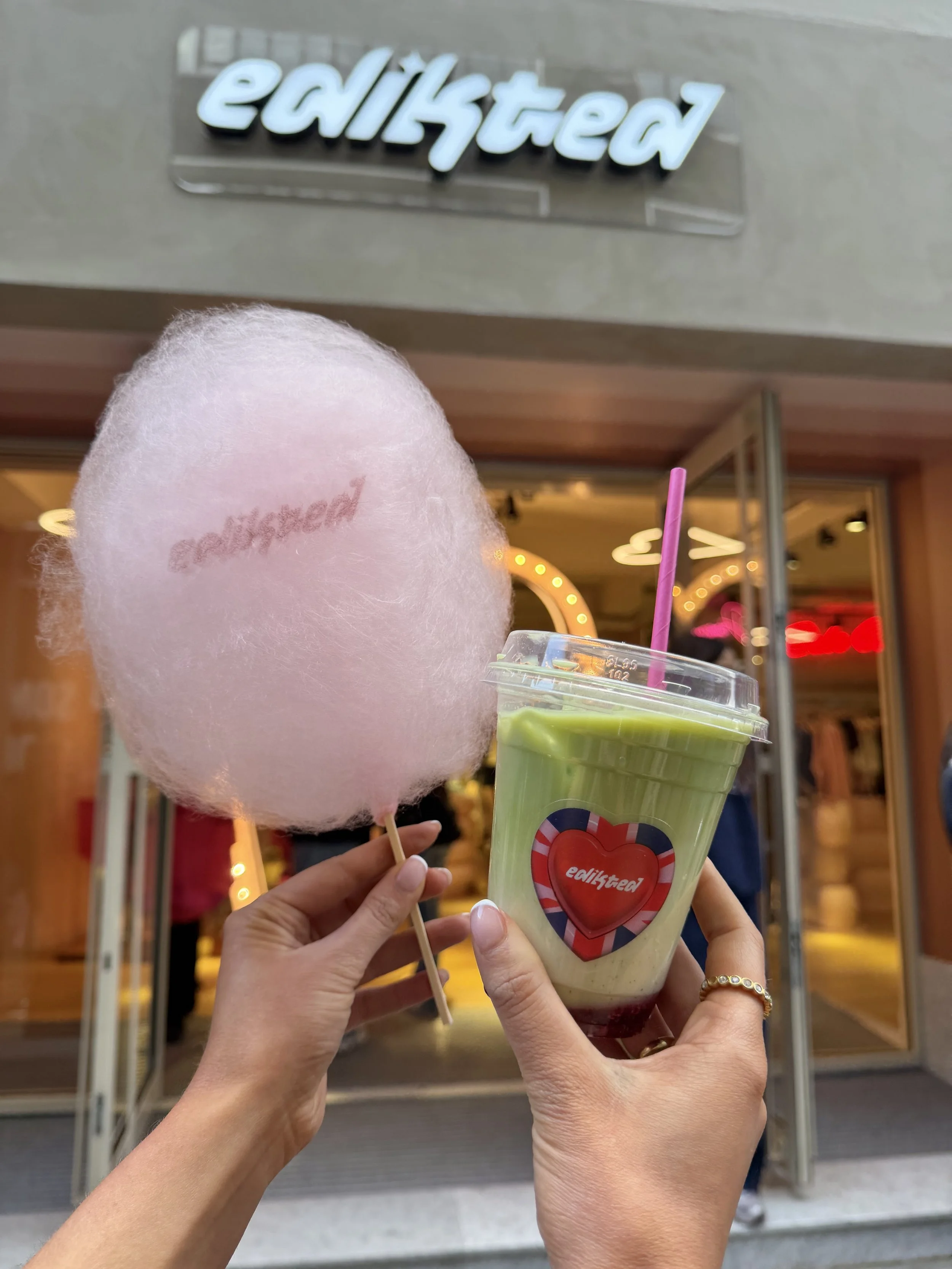 Edikted branded pink candy floss and iced matcha latte with a custom sticker at an Edikted retail brand activation