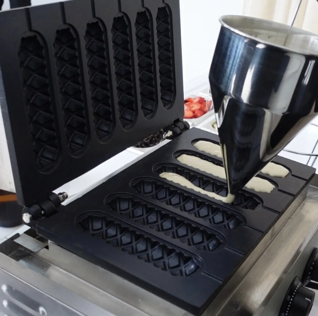 Interactive waffle cart featuring digital menus of delicious toppings like strawberries, bananas, and decadent waffle sauces.