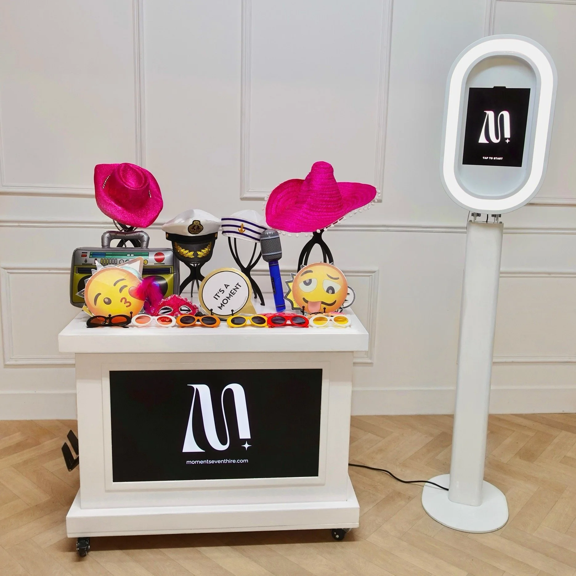 Selfie pod with props on white cart with digital screen