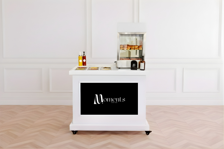 Hot dog machine on white cart with digital screen