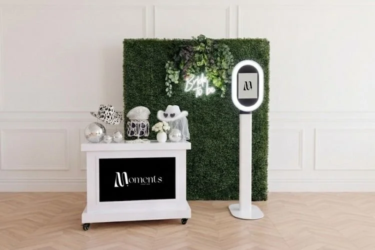 Selfie pod with props on white cart with digital screen