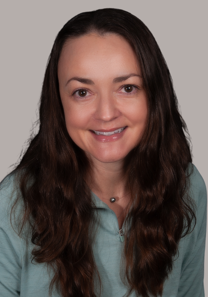 Headshot of Dr. Caroline Beall, double board-certified family and sports medicine physician.
