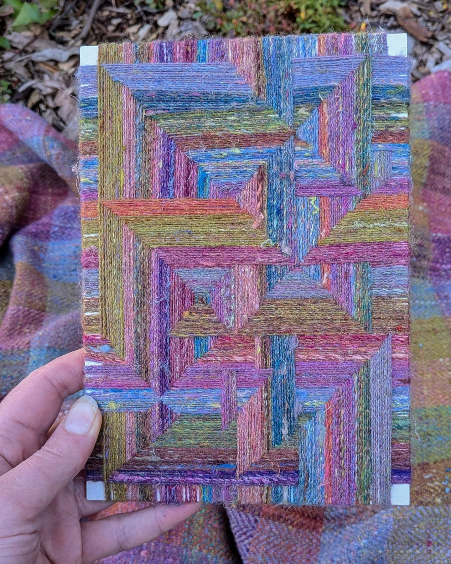 Handspun yarn &mdash; two ways. I've been experimenting with different ways to work with my handspun yarn, and I'm particularly pleased with this little piece, woven on board with yarn remaining from my travelling shawl.