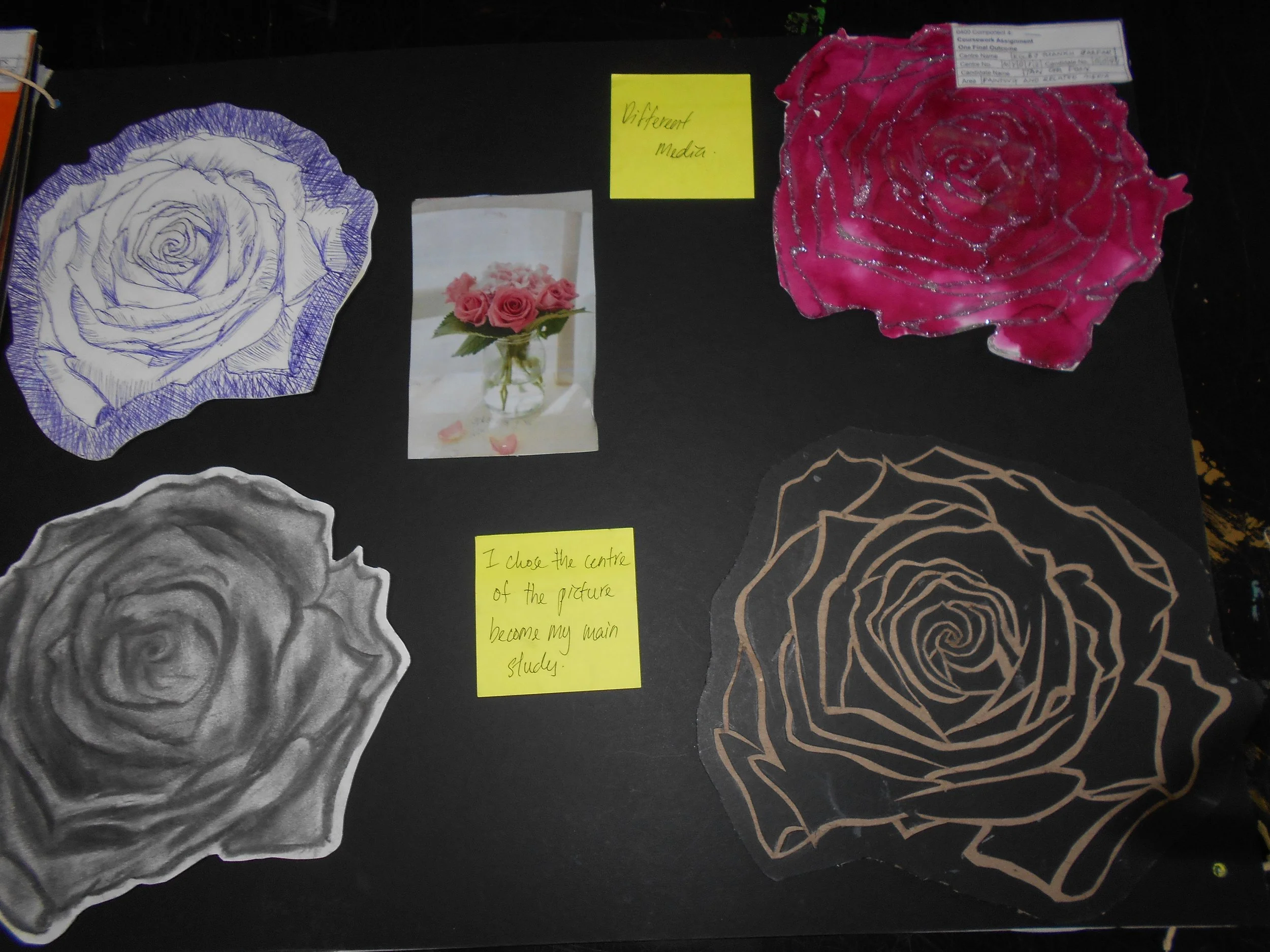 Black background with various drawings and cutouts of roses, a small photo of a vase with pink roses, and yellow sticky notes with handwritten notes.