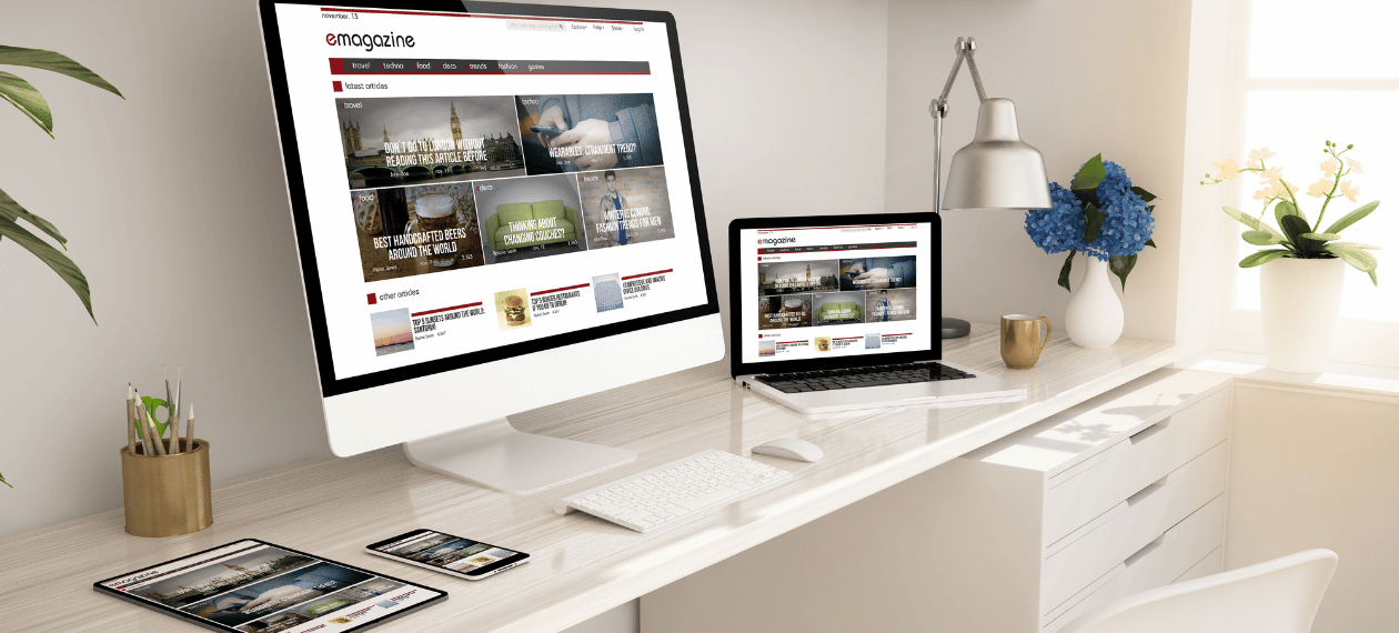 Website displayed across desktop, laptop, and mobile devices
