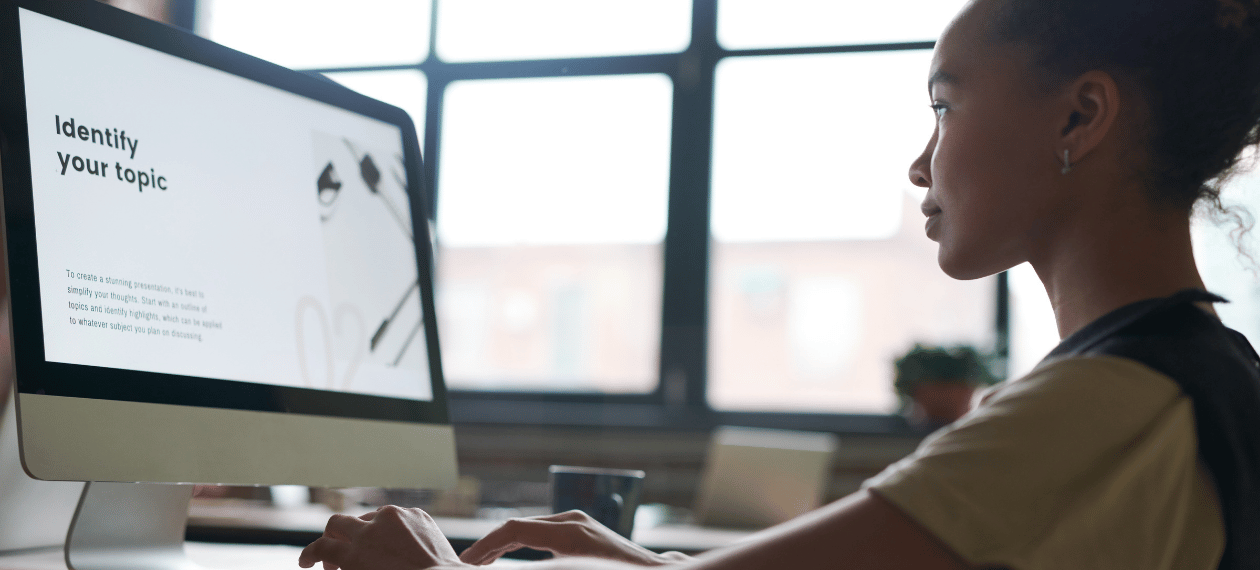 Business owner working on a website for an online coaching business