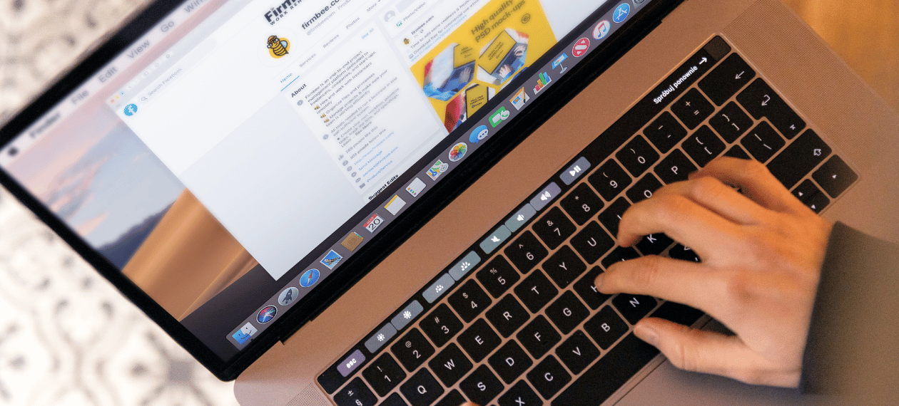 Person using a laptop to manage an online coaching business