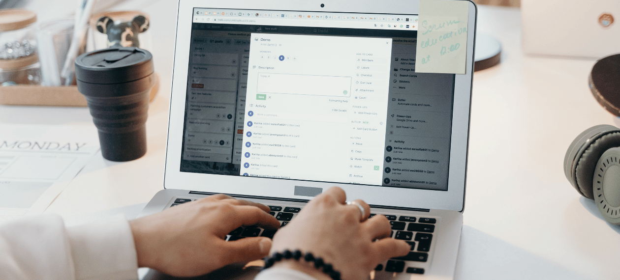 Person managing email communications and deliverability from a laptop