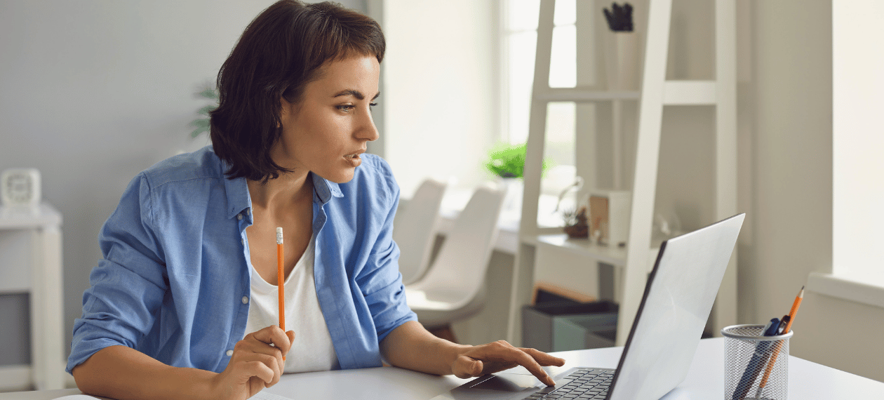 Business owner using a laptop to manage an online course