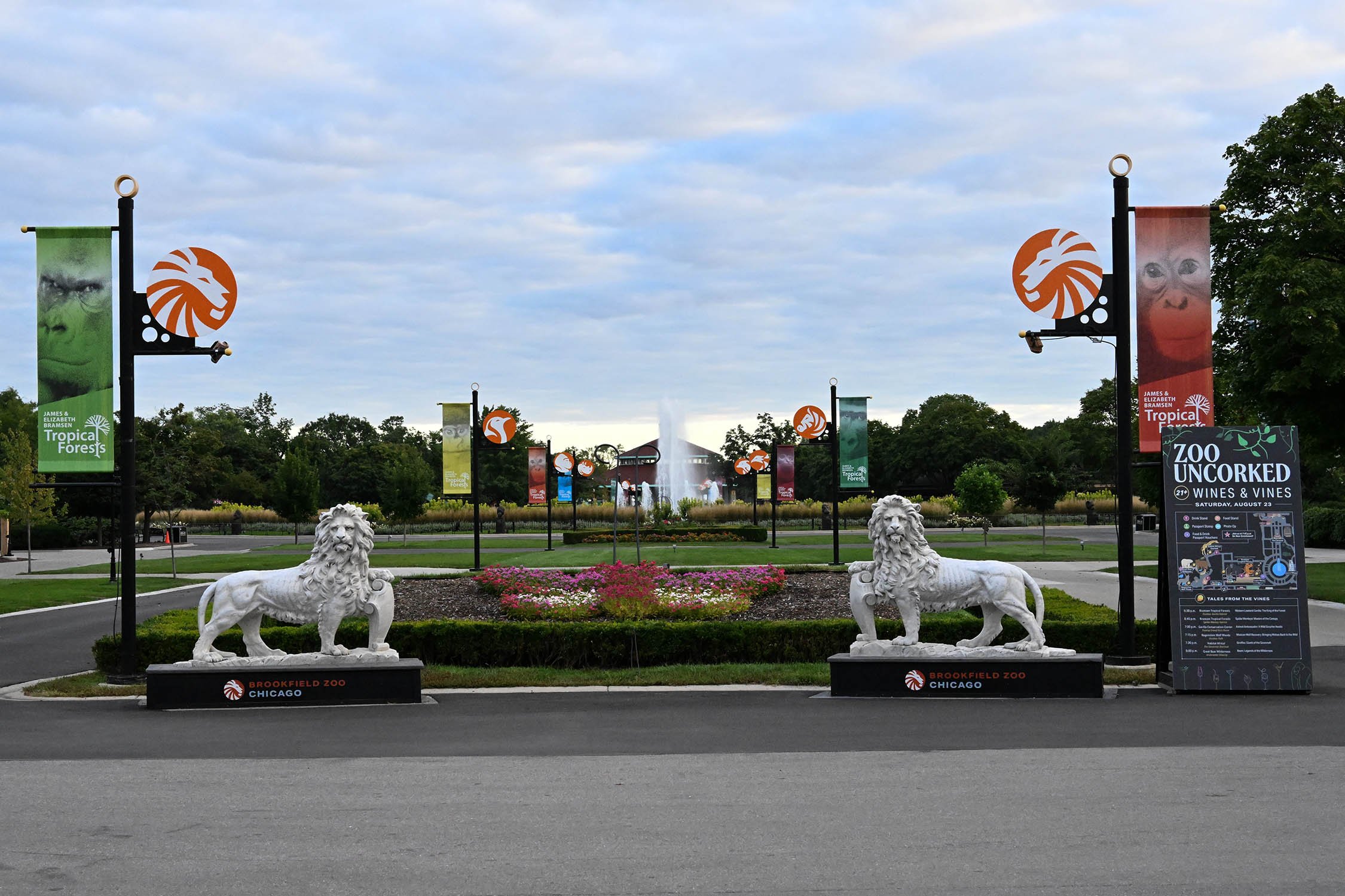 A graphic for Brookfield Zoo's 100th anniversary showing a lion's face and the zoo's logo with stylized lion heads.