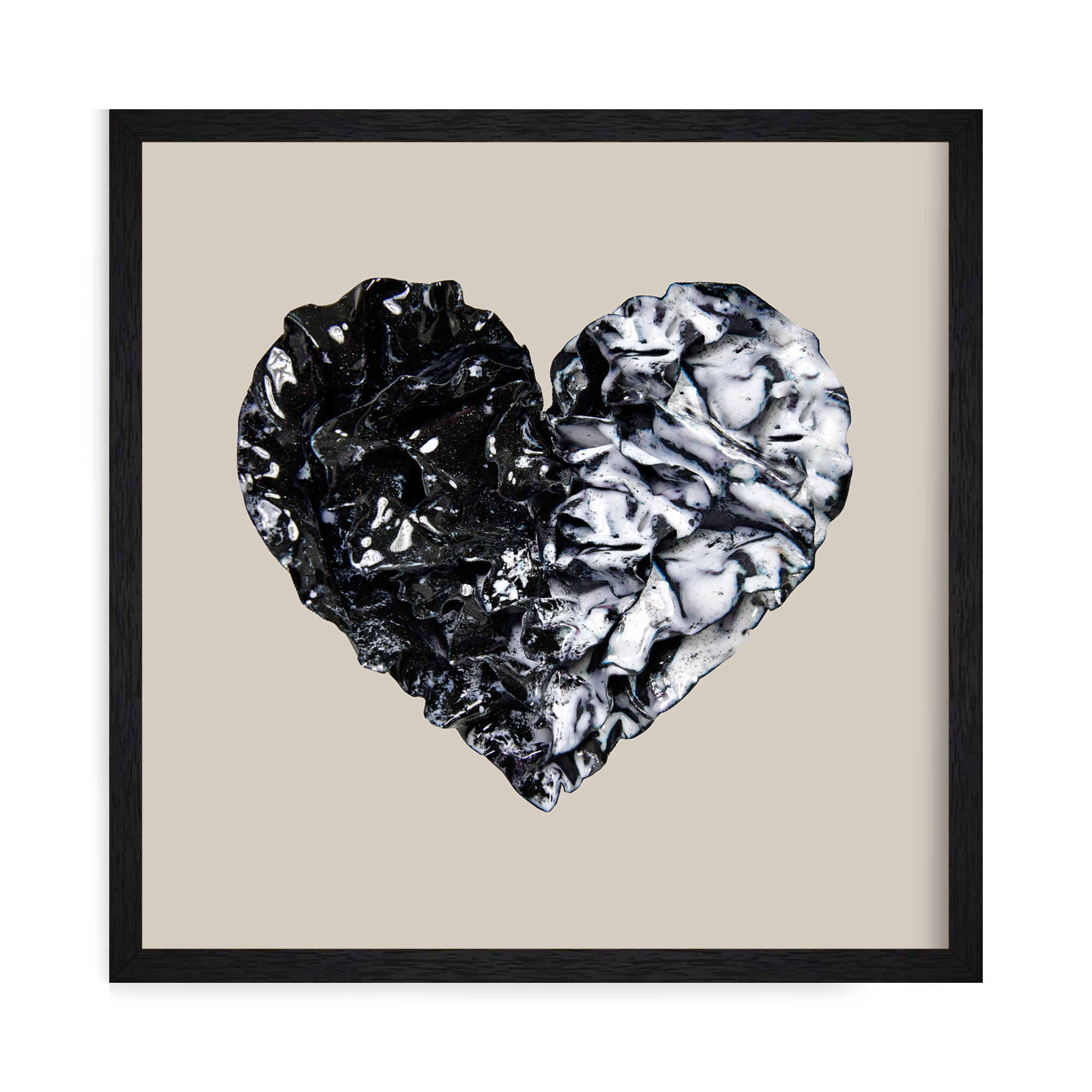 Framed Black and white enamel heart sculpture with textured folds and a split design, part of Sherry Been’s Black Collection