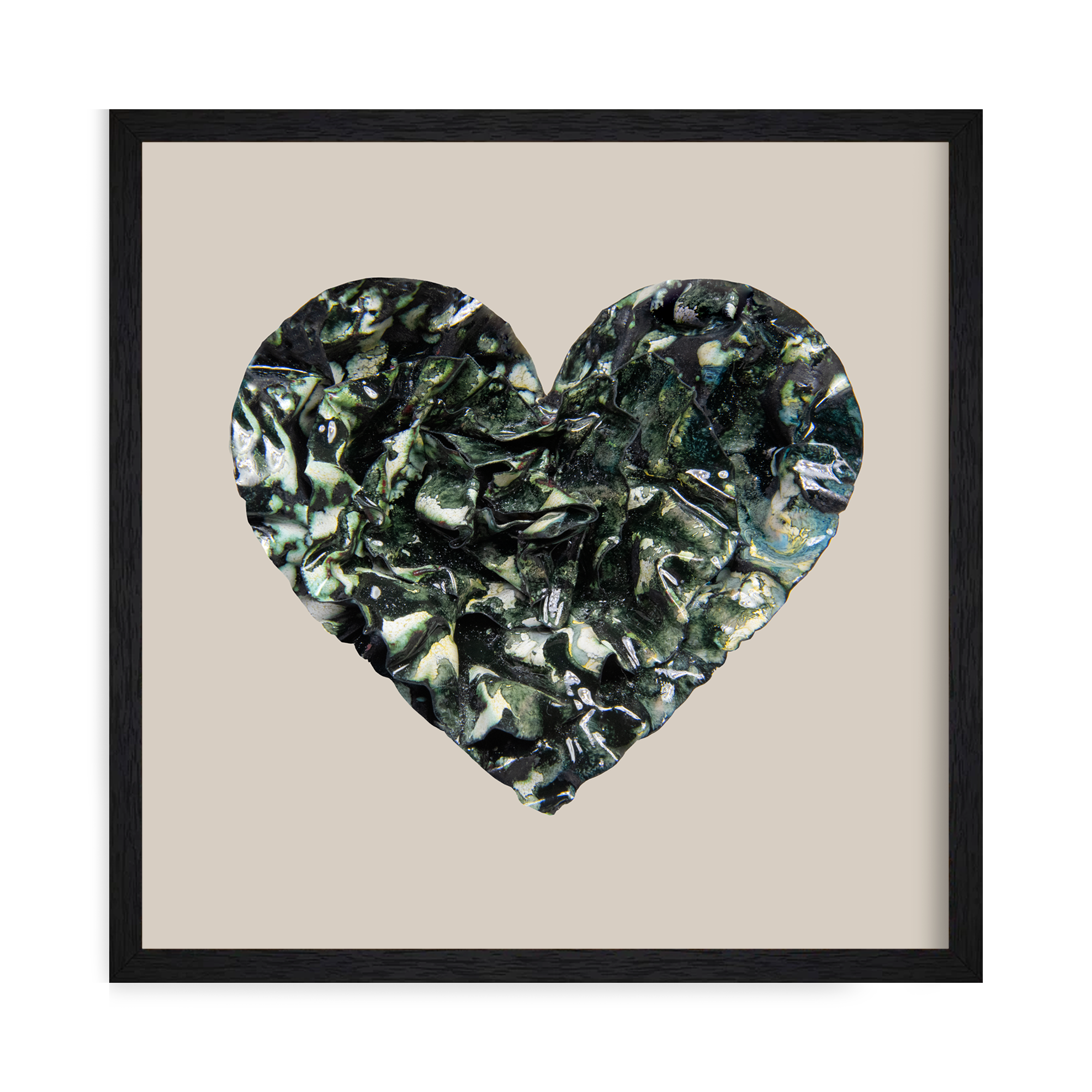 Framed heart print in glossy black and dark green tones with textured, leaf-like folds and natural veining