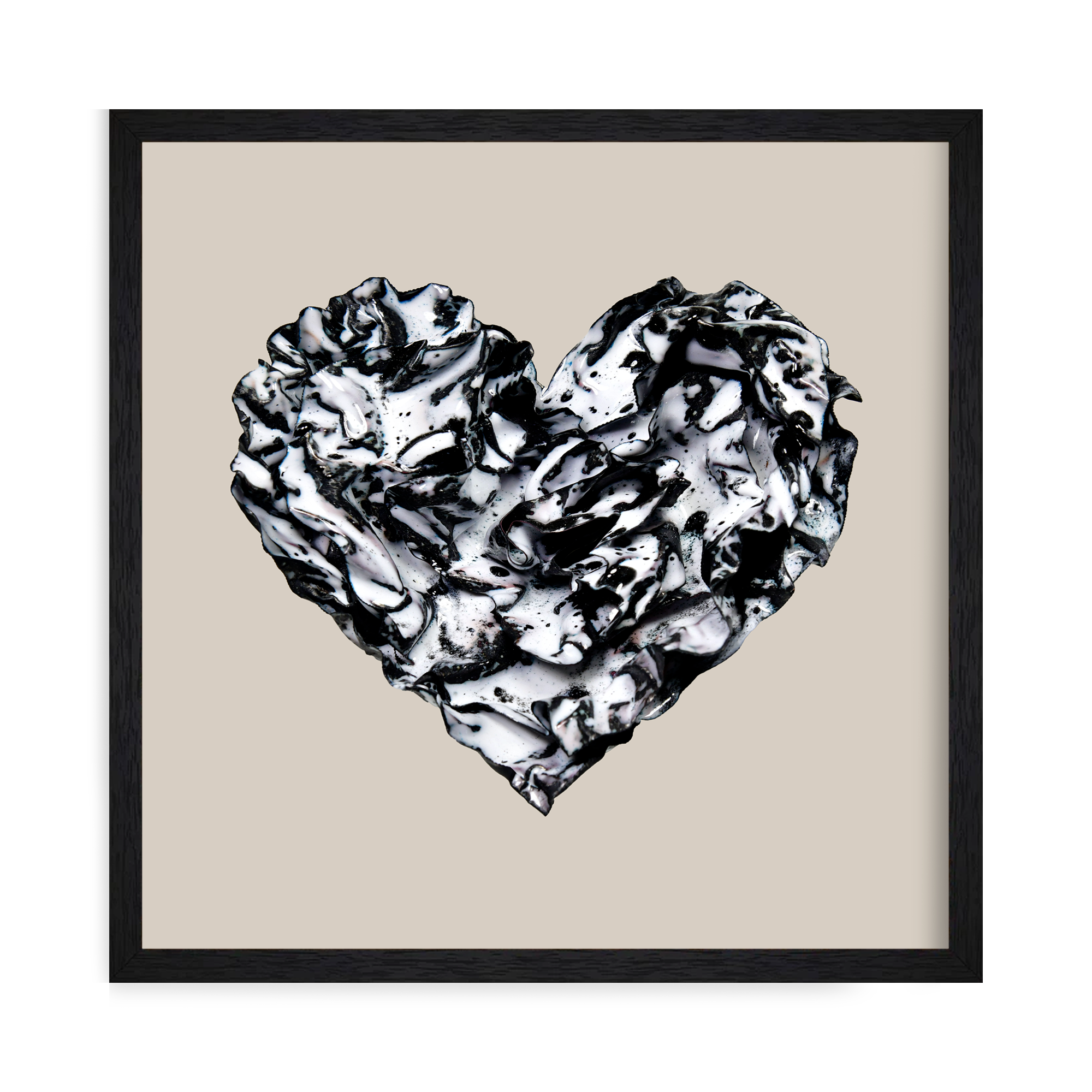 Framed Black and white enamel heart sculpture titled “Still Ink” with glossy, marbled folds and fluid texture