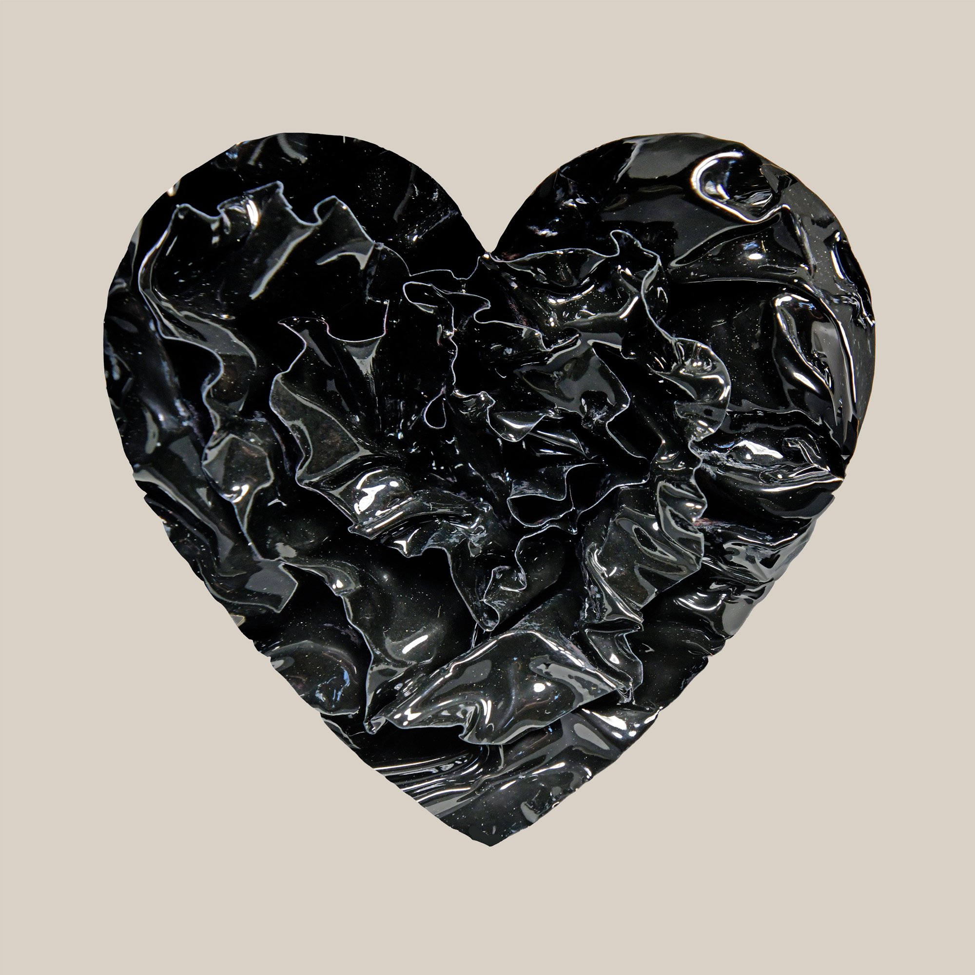 Glossy black enamel heart sculpture with folded, reflective texture, titled “Onyx Veil”