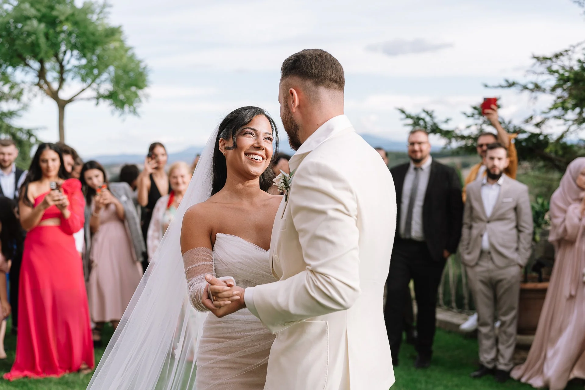 First dance, smiles, candid moment in Tuscany