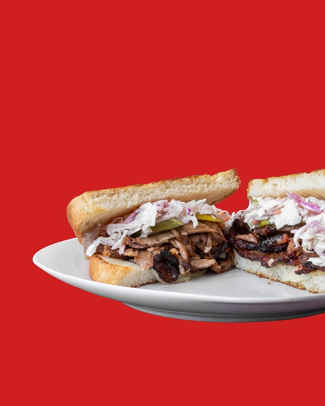Tender, saucy pulled goodness piled high with crunchy coleslaw on toasted bread. The perfect bite of sweet, smoky, and fresh. Grab one today!

#Gourmeltz #PulledPorkPerfection #SandwichHeaven