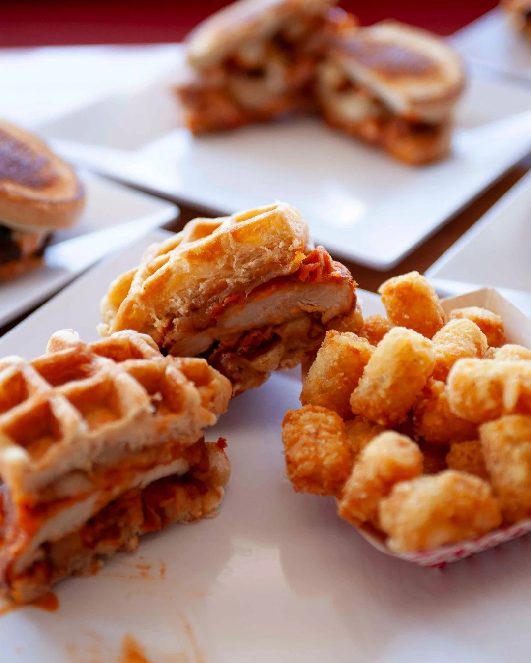 Sweet meets savory in the best way possible 🧇 🍗 Crispy fried chicken sandwiched between fluffy waffles, side of golden tots... pure magic in every bite.

#Gourmeltz #ChickenAndWaffles #FoodieFavorites