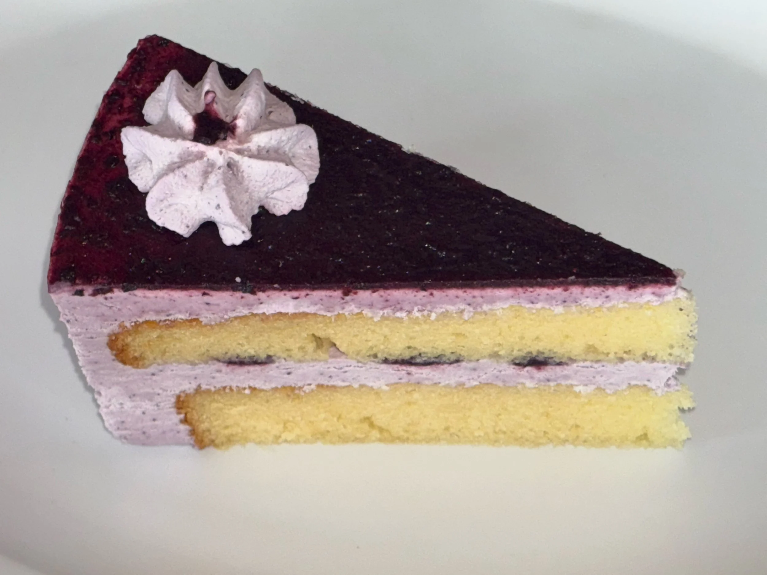 Purple never looked so delicious. 💜🫐 Introducing our limited Mother&rsquo;s Day special &mdash; Blueberry Mousse Cake. Layers of fluffy golden sponge, creamy blueberry mousse, and a stunning berry glaze. Only available this week, so don&rsquo;t sle