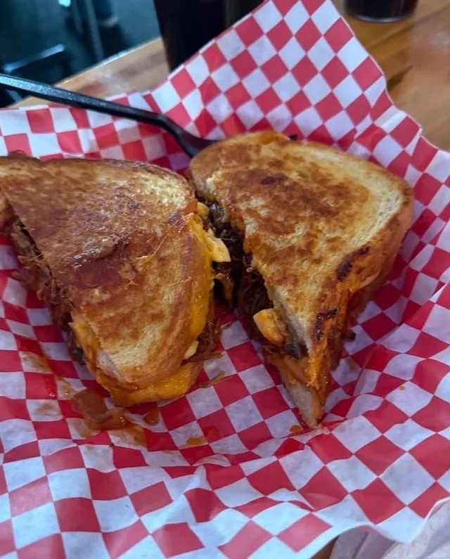 Southern Comfort Melt, cut and ready.
Smoked meat, melty cheese, that perfect golden toast.
One bite and you&rsquo;ll understand the hype.