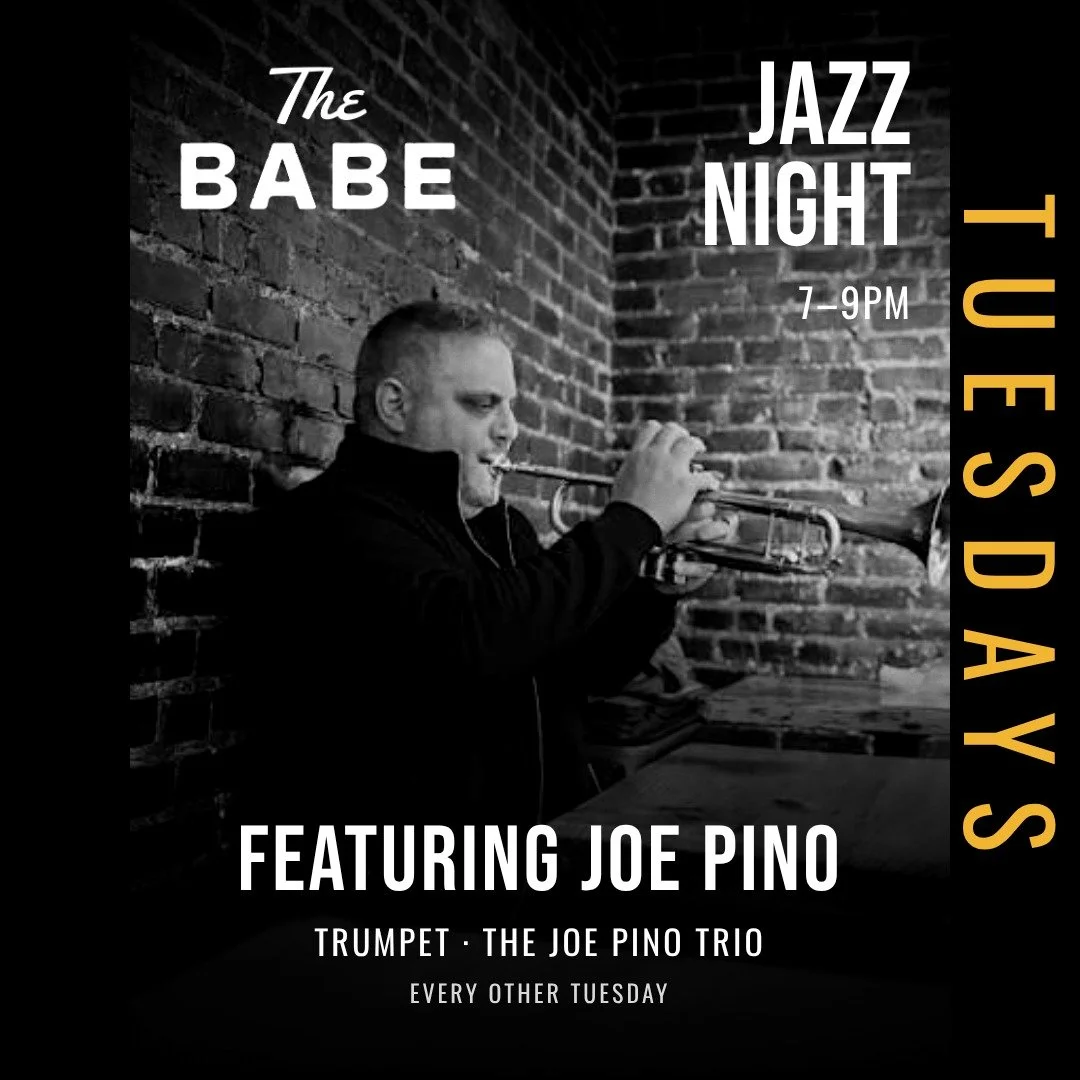Black and white concert poster for a jazz night featuring a guitarist. The poster features a young man in a suit playing an acoustic guitar. Text includes "The Babe," "Jazz Night 7-9PM," and mentions performers Steve Lacey on guitar and Pat Dole on bass. On the right side, there is a yellow vertical text that says "TUESDAY'S DAY."