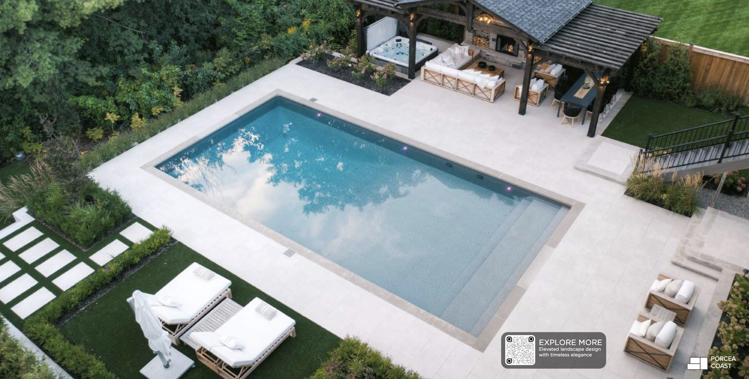 Rectangular swimming pool with light stone coping and minimalist hardscape design in a contemporary Toronto backyard.