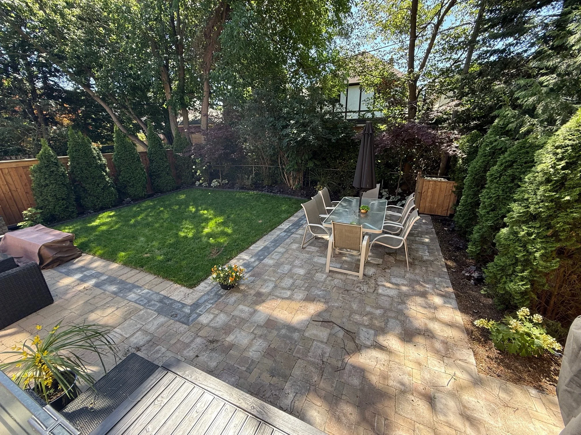 after photo of a backyard landscape transformation done by Master In The Field