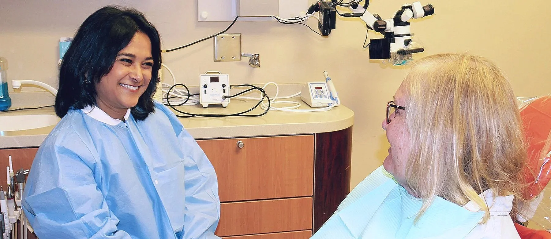 UDA dentist talking with a patient.
