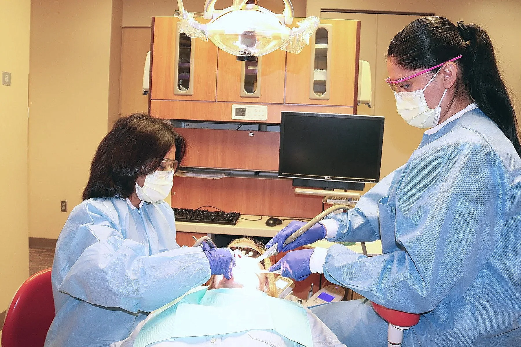 A patient receives dental treatment.