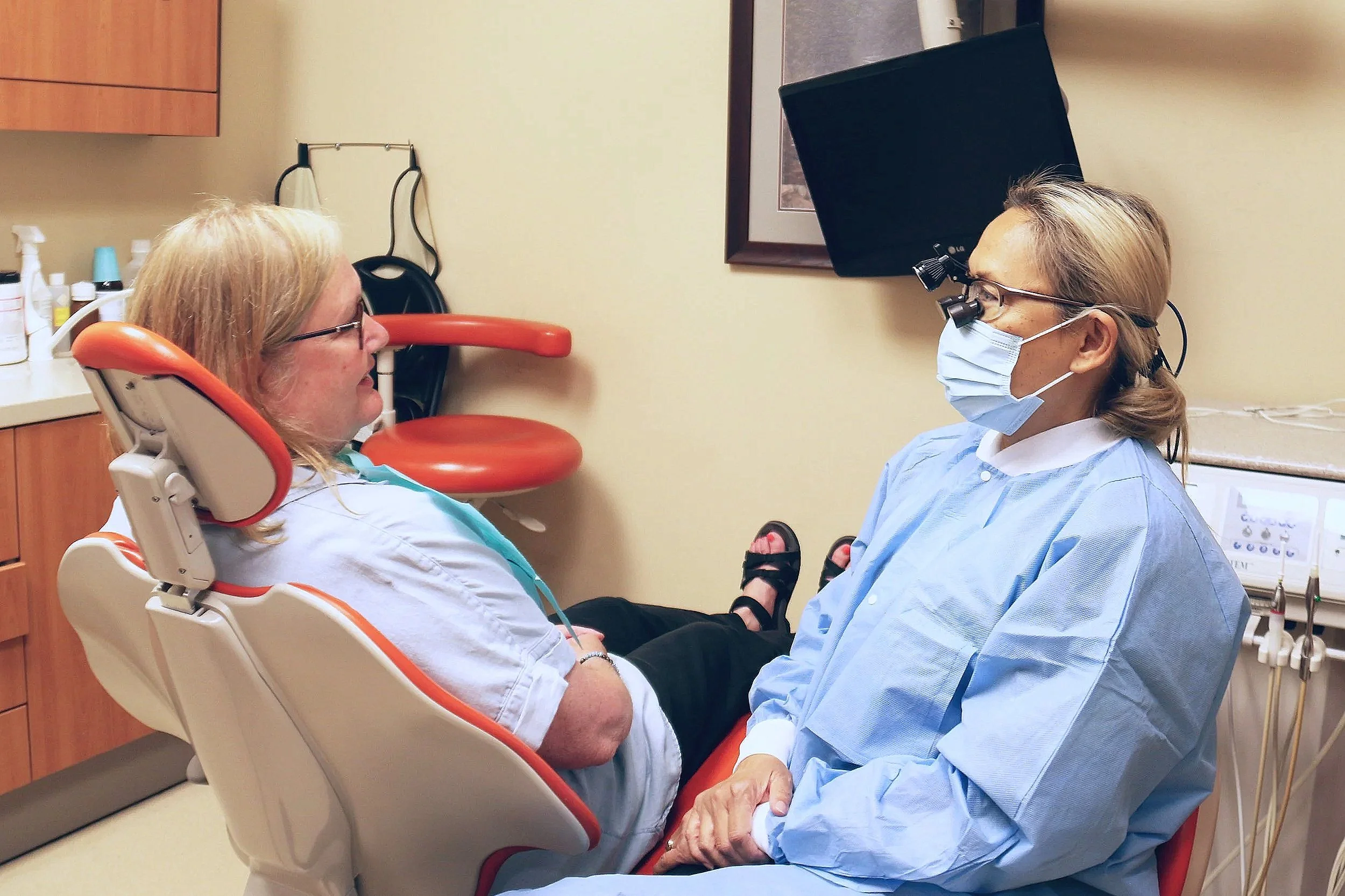 UDA dentist talking with a patient.