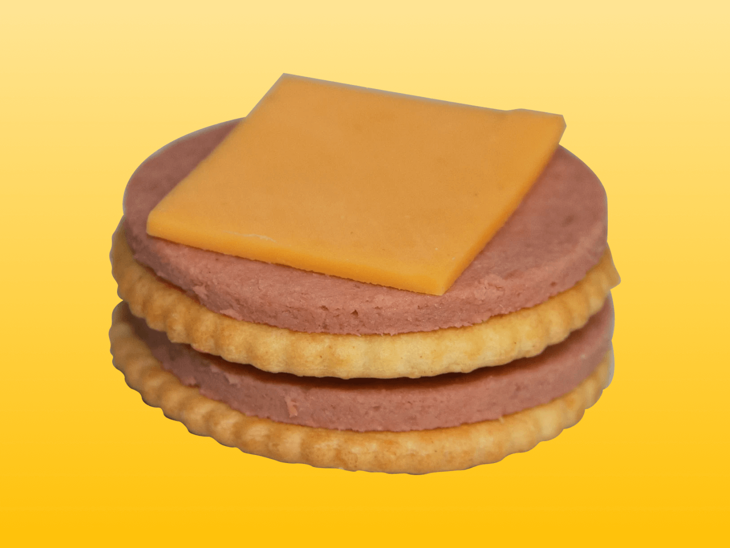 Detail of Plant-Based Ham and Cheese Mighty Yum Munchables on yellow background