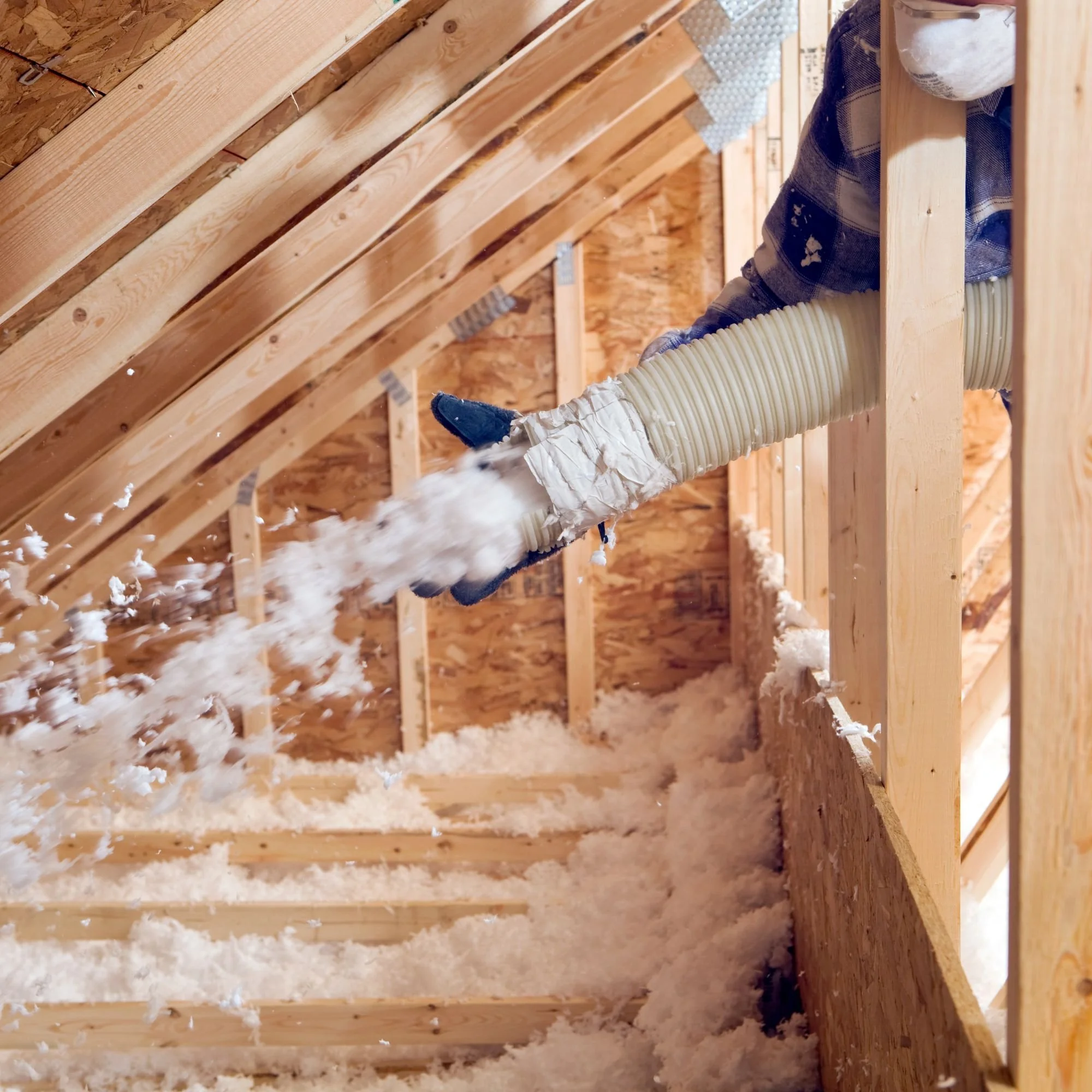 Attic insulation protecting roof from ice dams in Michigan winter