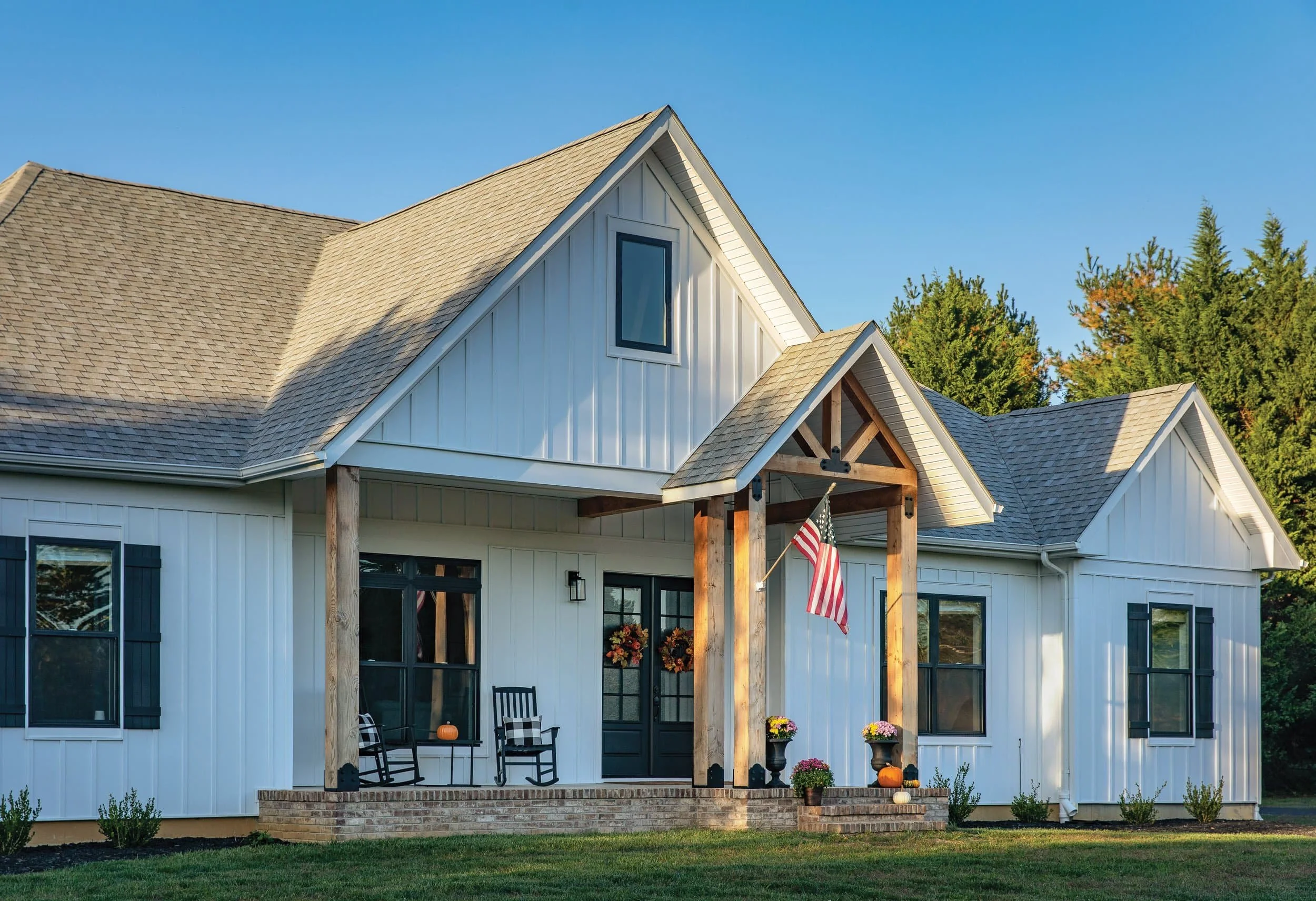 White James Hardie fiber cement siding with board and batten accents on modern farmhouse exterior