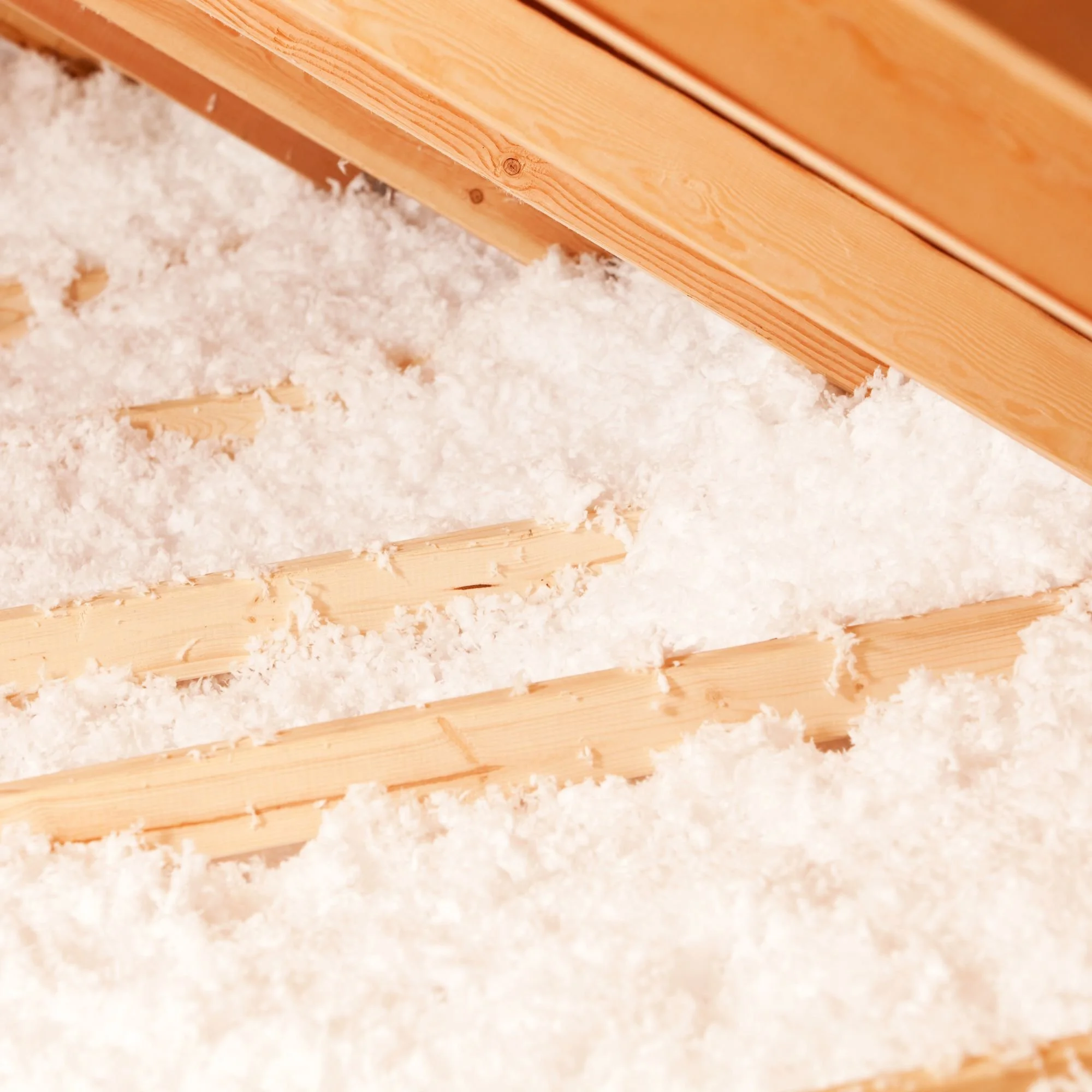 Professional inspecting home insulation levels in Michigan attic