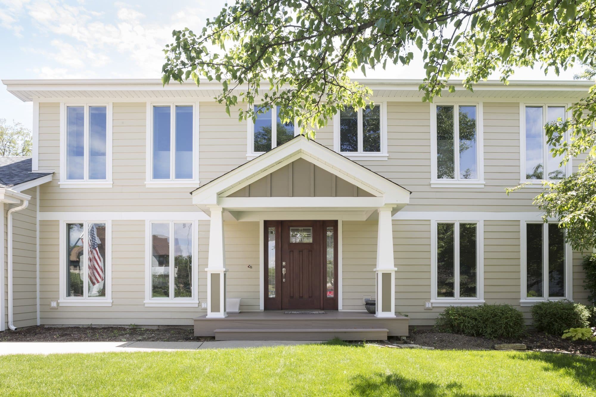 Modern white and black two-tone James Hardie siding on new construction home with dark accents