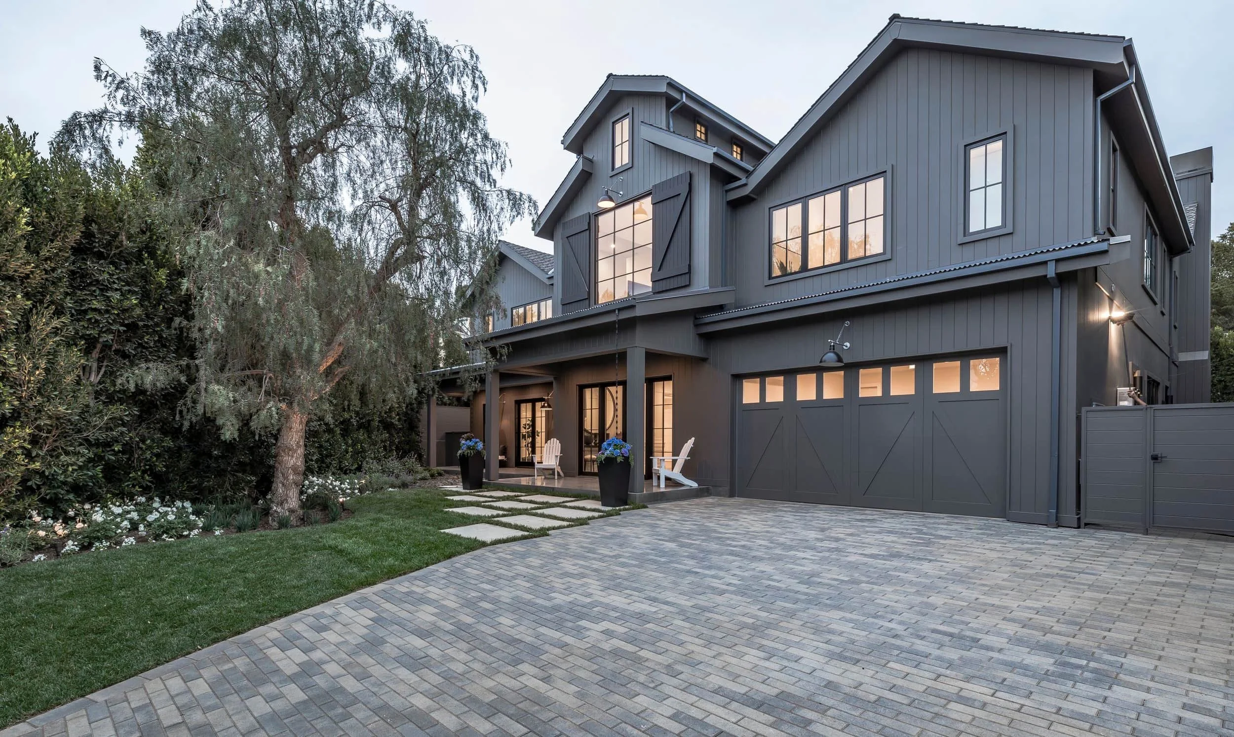 Dark charcoal James Hardie siding with black trim and modern architectural details on residential home