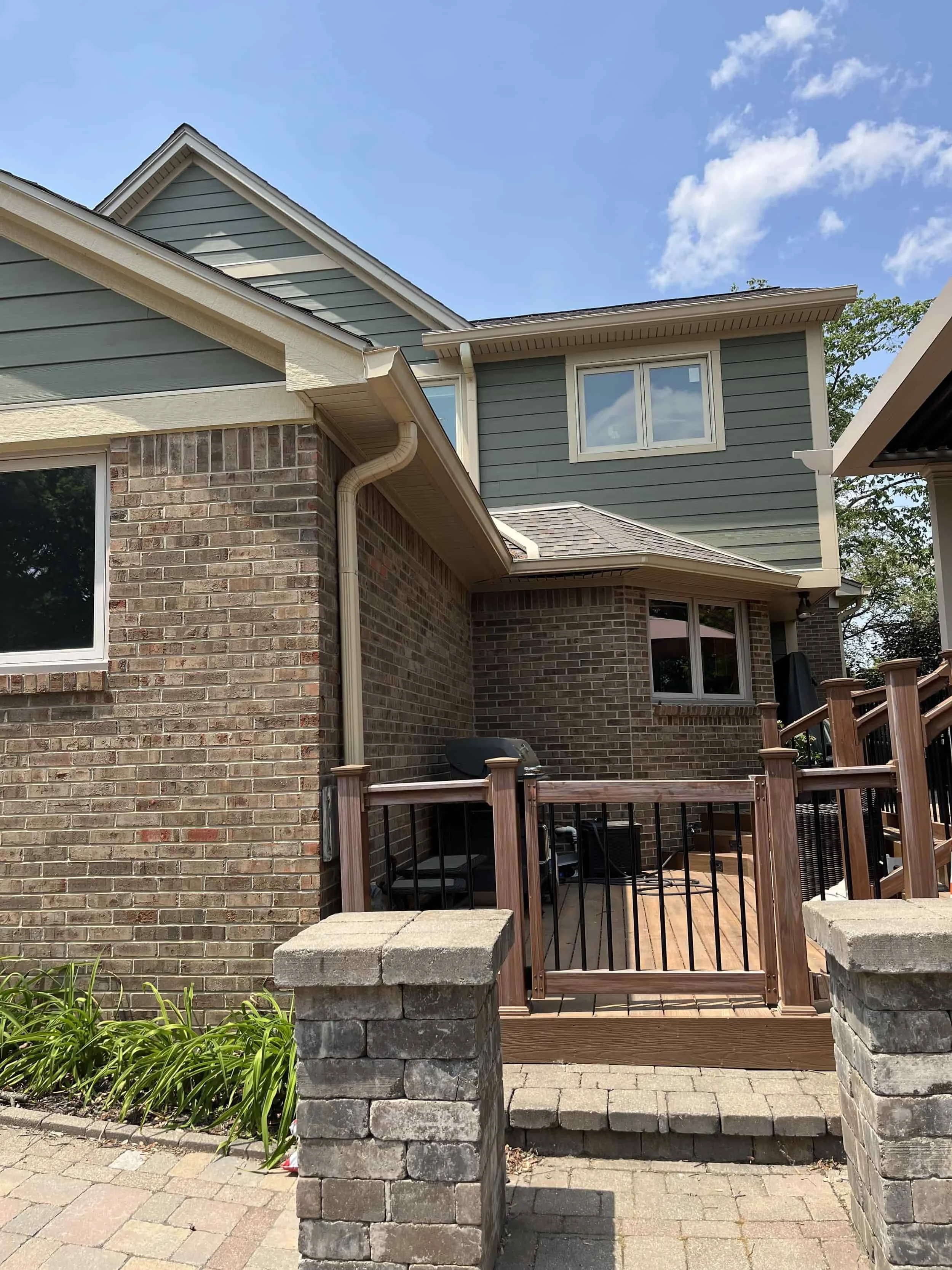 James Hardie fiber cement siding with brick accents on custom home exterior