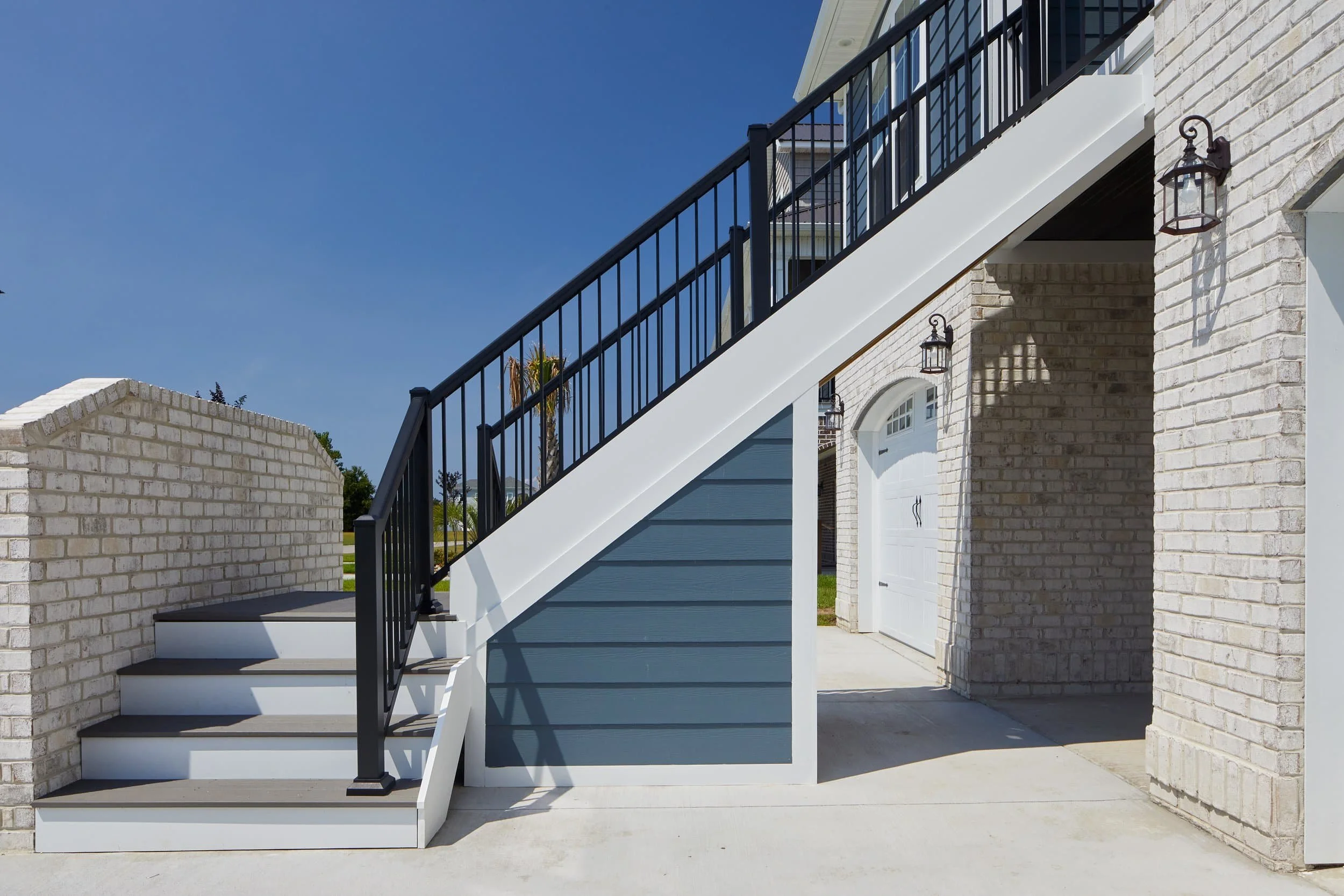 Weathered wood deck with outdoor furniture showing signs of age and wear