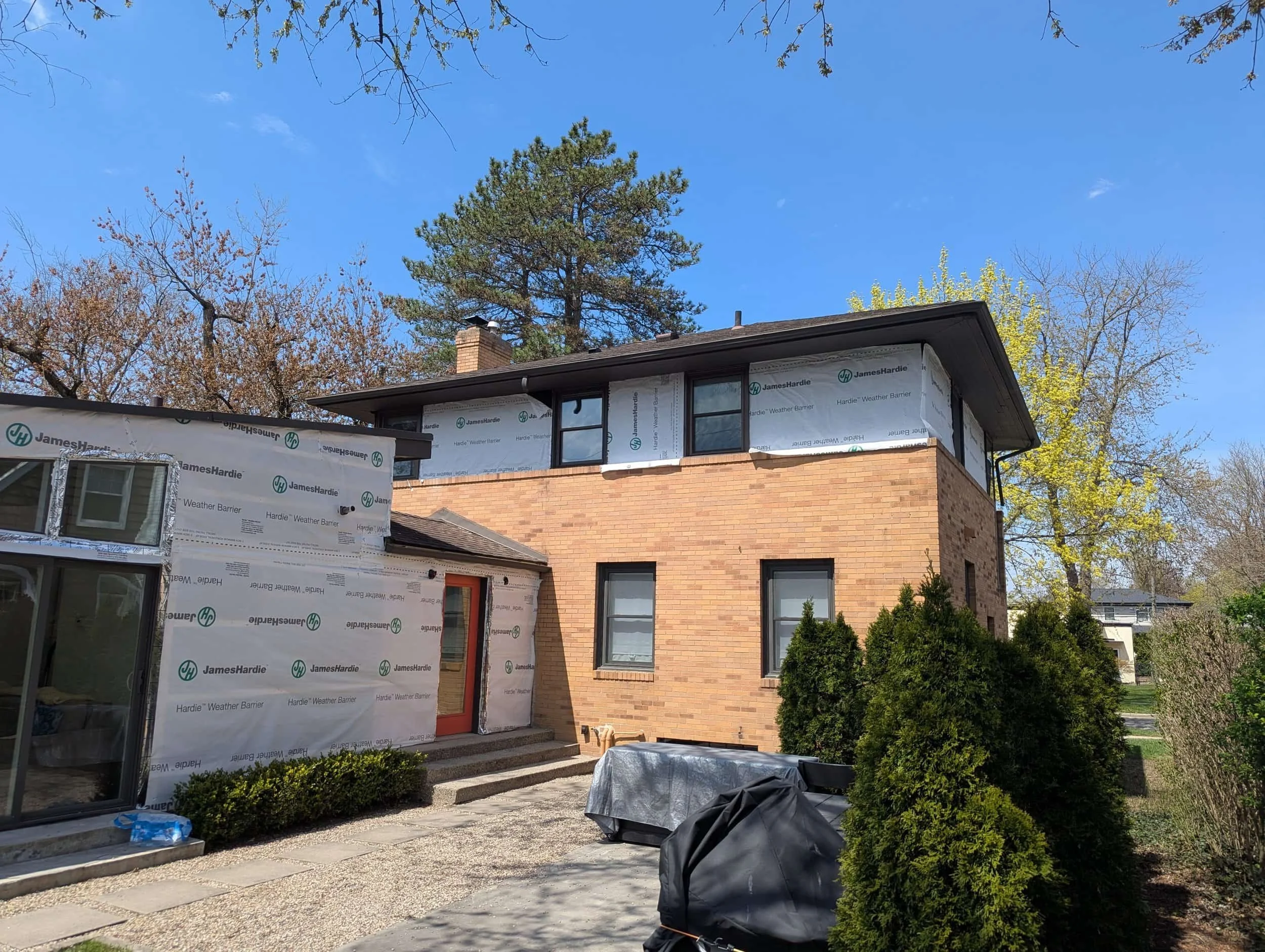Vinyl siding on traditional two-story home in Southeast Michigan neighborhood
