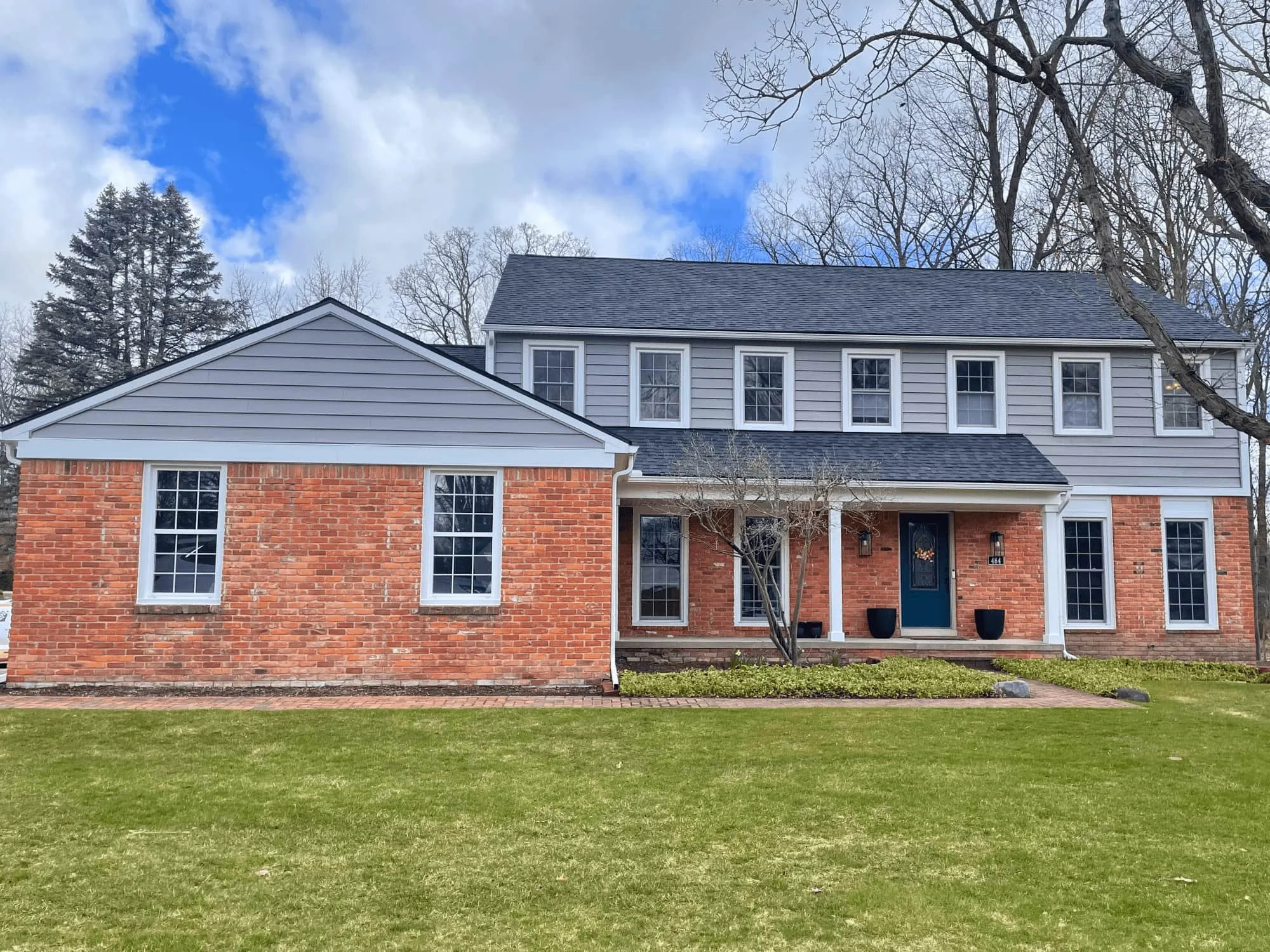 LP SmartSide engineered wood siding installation on two-story residential home