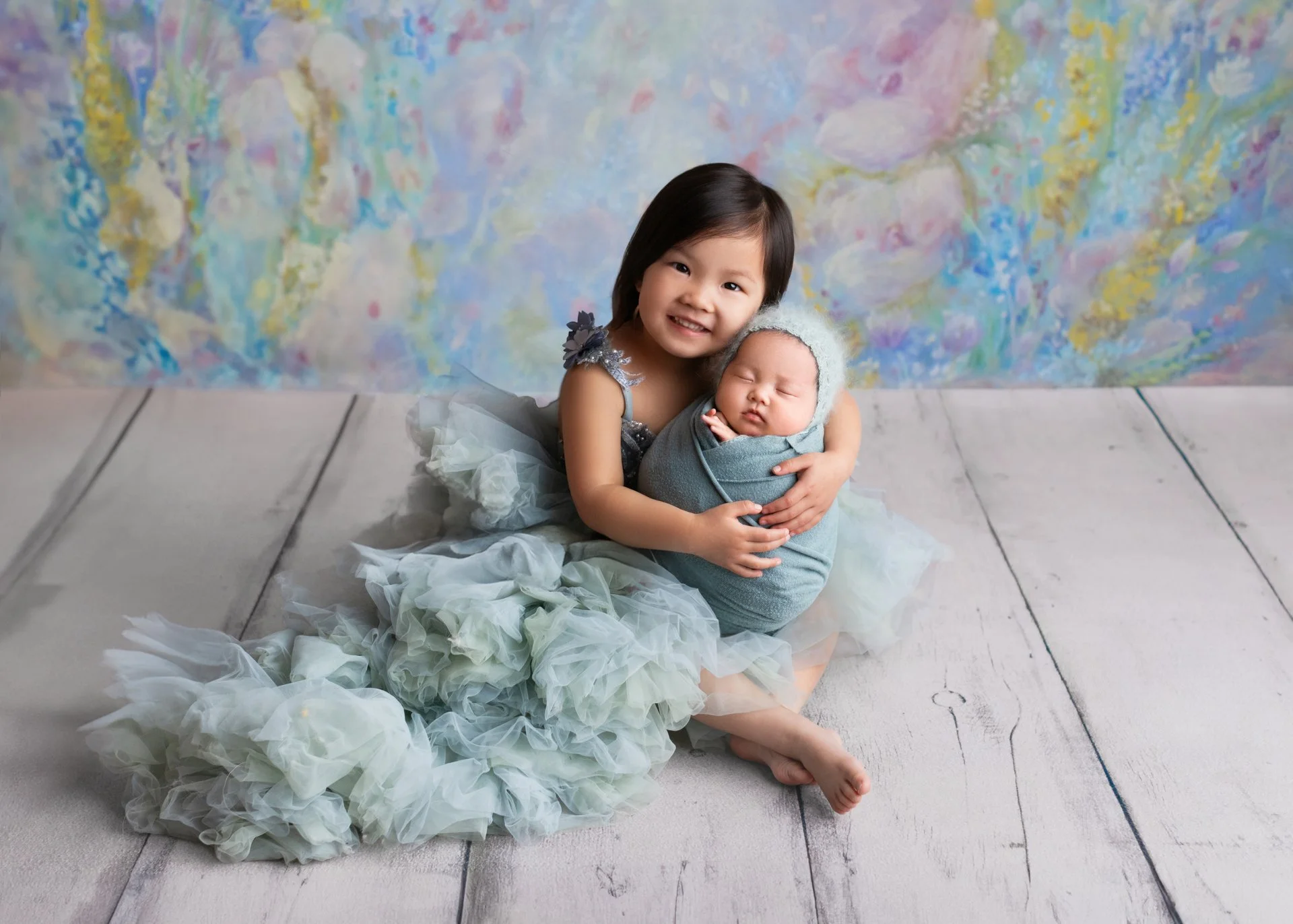Smiles On! A Guide to Getting Your Toddler to Cooperate at Your Newborn Photoshoot