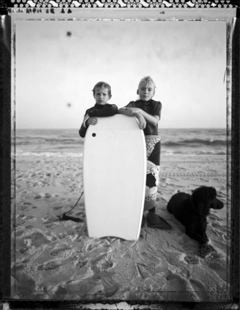 ZACH AND FRIEND WITH SURFBOARD.jpg