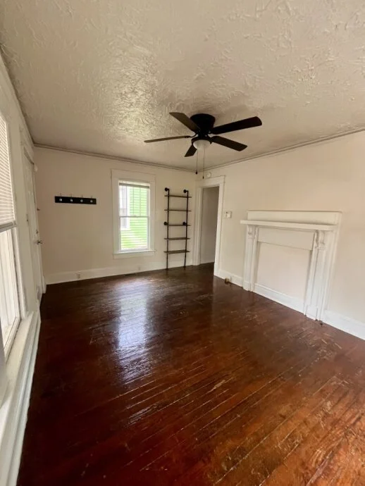 spacious room with shelf