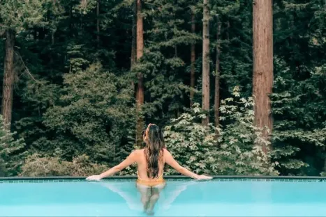 Pool-in-forest-with-woman.png