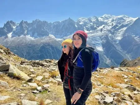 Sunny-Smiling-at-the-camera-with-her-daughter-on-a-mountain.png