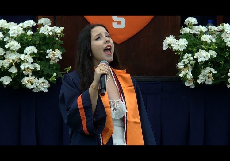 Singing the National Anthem at my graduation. Singing for the first time without a mask!