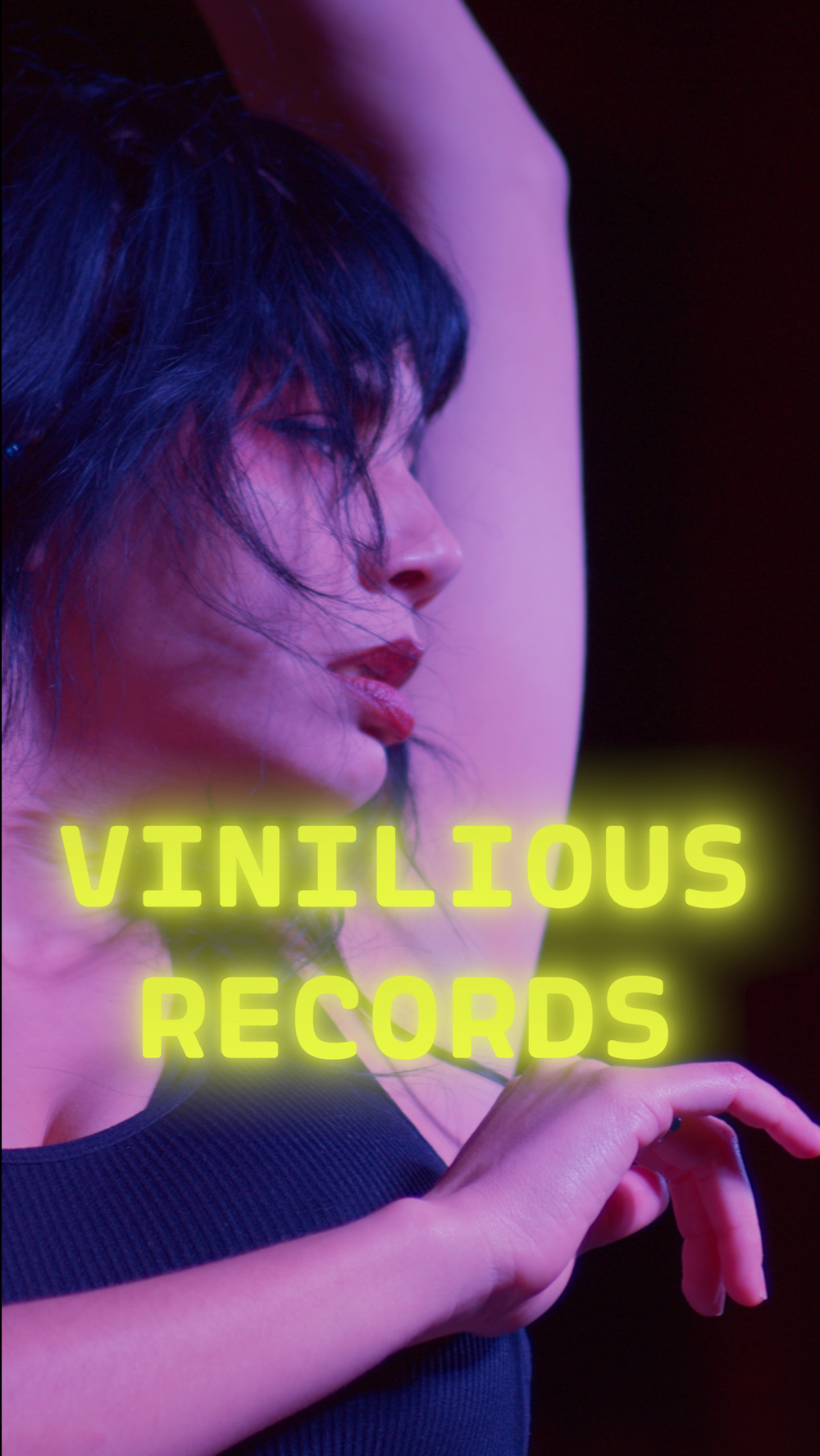 Portrait-format artwork for Vinilious Records featuring a musician in colored light