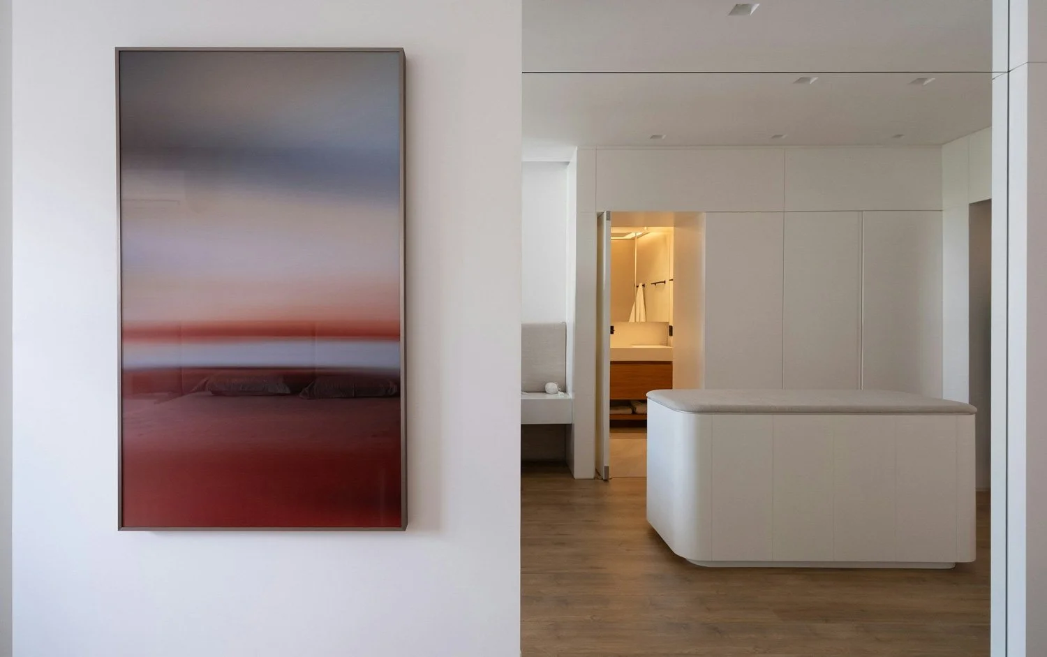 A single frame piece of art in a calm interior.