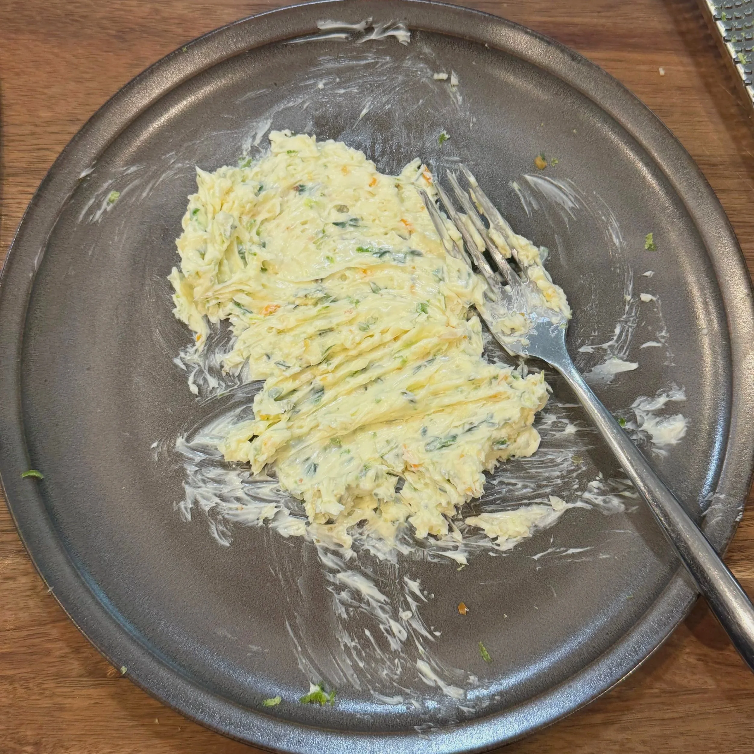Herb and scotch bonnet compound butter melting on top of sliced steak
